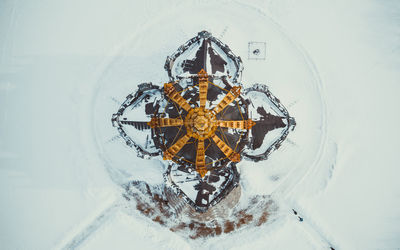 High angle view of snow on street amidst buildings in city