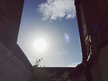 Low angle view of house against cloudy sky