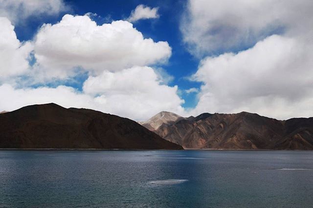 mountain, sky, water, tranquil scene, scenics, mountain range, waterfront, tranquility, beauty in nature, cloud - sky, nature, cloud, cloudy, sea, lake, idyllic, non-urban scene, day, outdoors, rippled