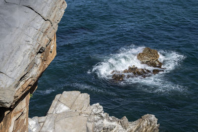 High angle view of rock formation in sea