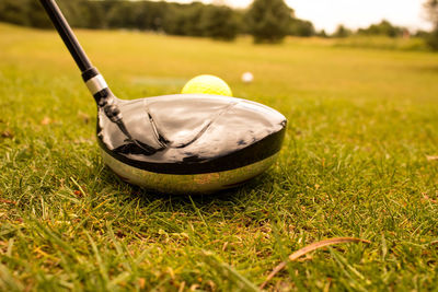 Close-up of golf ball on field