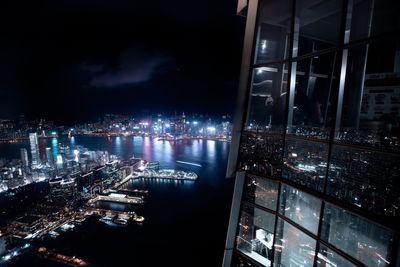 High angle view of city lit up at night