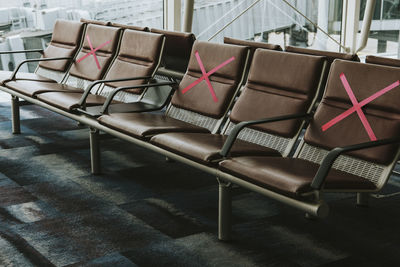 Empty chairs and tables in airport