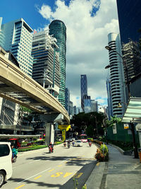 City street by buildings against sky