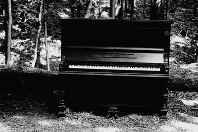 Abandoned piano on field