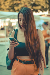 Young woman using mobile phone