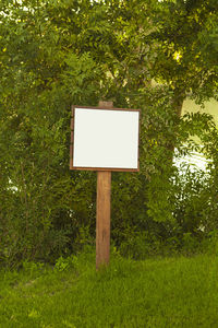 Information sign on tree in park