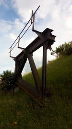 Wind turbines on grassy field