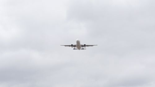 Low angle view of airplane in sky