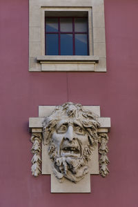 Low angle view of statue against building