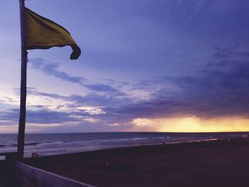 Scenic view of beach against sky during sunset