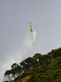 Low angle view of vapor trail against clear sky