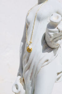 High angle view jewelry against statue 