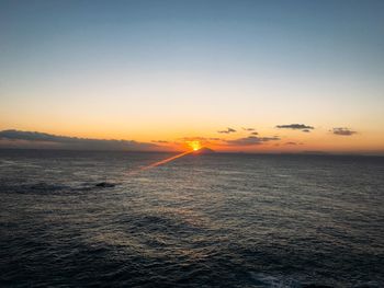 Scenic view of sea against clear sky during sunset