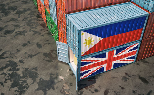 Freight containers with united kingdom and philippines flag.