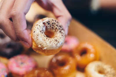 Cropped hand of person holding food