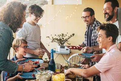 Friends and son at table