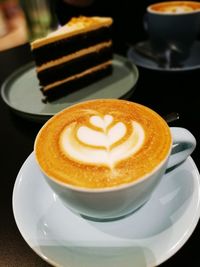 Close-up of cappuccino served on table