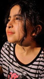 Close-up portrait of young woman looking away