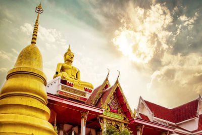 Low angle view of temple against building