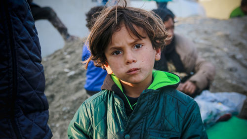 Portrait of boy in city