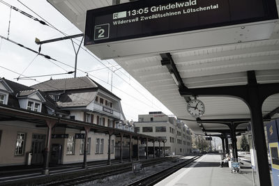 Train at railroad station against sky