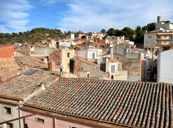 Houses in town against sky