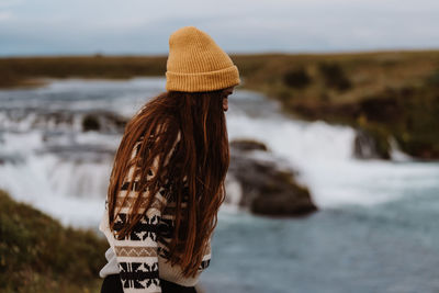 Rear view of woman holding ice