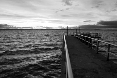 Pier on sea against sky