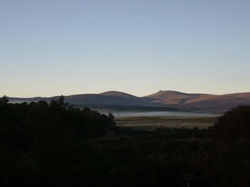 Scenic view of mountains against clear sky