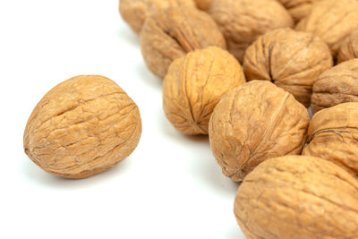 Close-up of fruits on table against white background