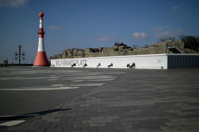 View of lighthouse against cloudy sky