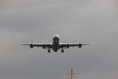 Low angle view of airplane against sky