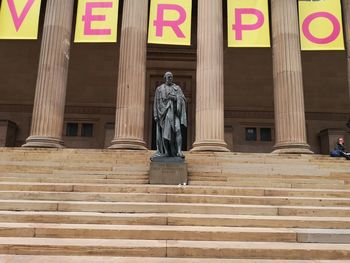 Low angle view of statue against building