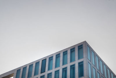 Low angle view of modern building against clear sky