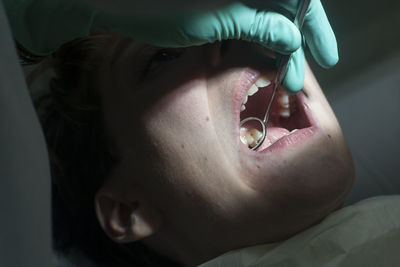 Close-up of dentist treatment to patient 