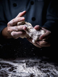 Midsection of man preparing food