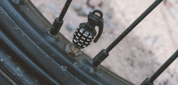 Close-up of grenade shape valve stem on tire