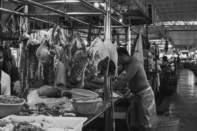 Group of people at market stall