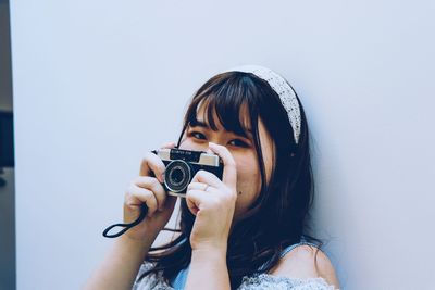 Portrait of woman photographing