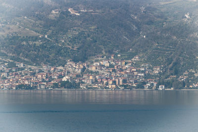 Aerial view of city by sea