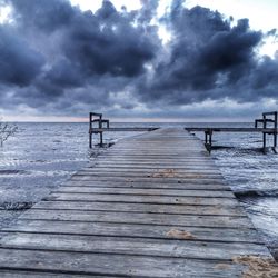 Pier over sea against sky