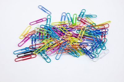 Close-up of multi colored pencils against white background