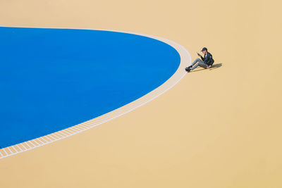 High angle view of man playing on swimming pool