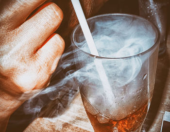 Close-up of hand holding ice cream