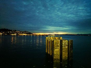 Scenic view of river against sky at night