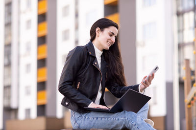 Young woman using mobile phone