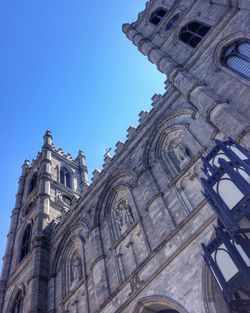 Low angle view of church against blue sky