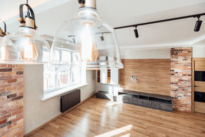 Empty living room with edison lamps