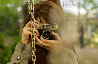 Portrait of woman photographing